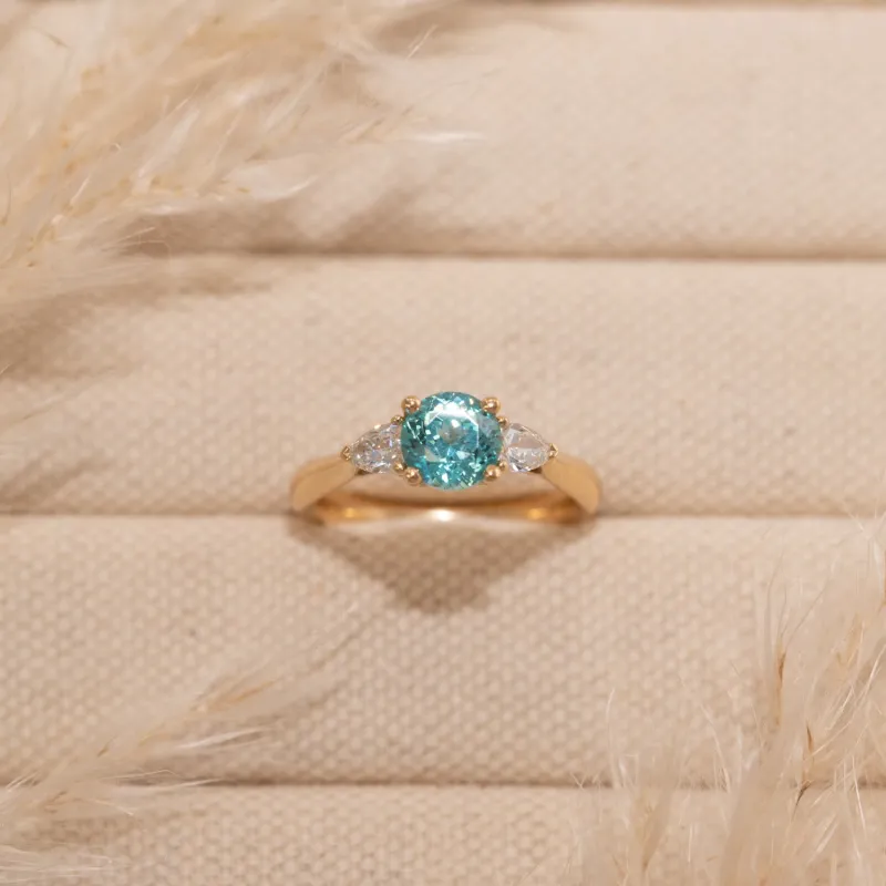 The Sophia Ring | 1.98ct Brilliant Cut Paraiba Tourmaline Trilogy 9k Yellow Gold sold by Ethica Diamonds