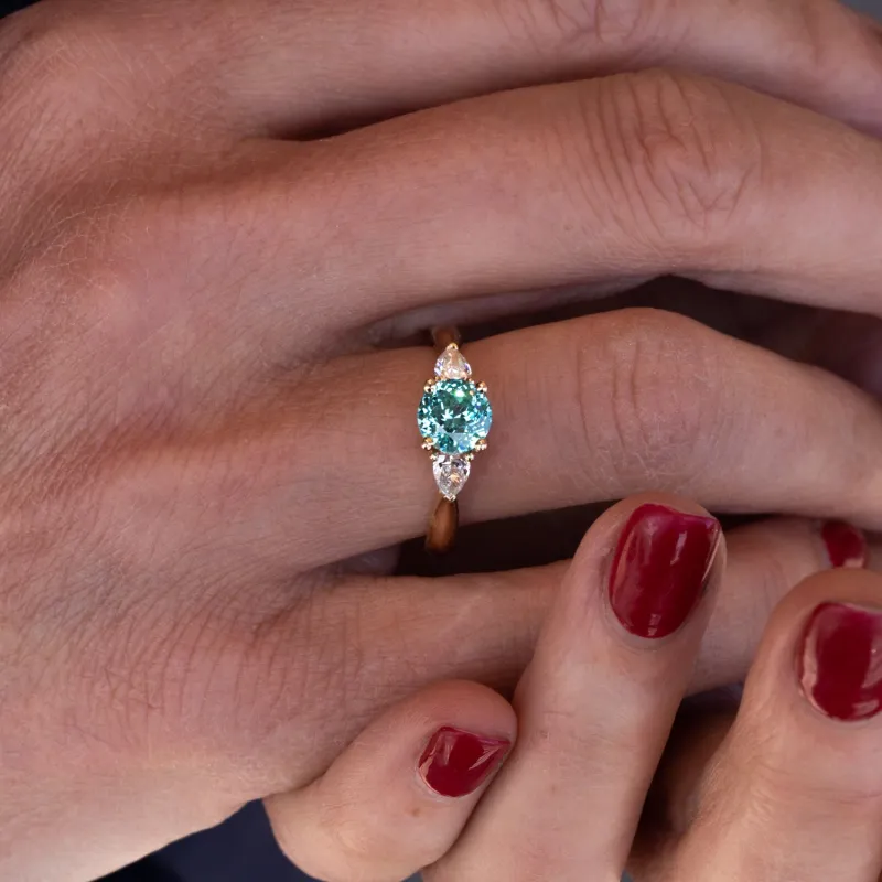 The Sophia Ring | 1.98ct Brilliant Cut Paraiba Tourmaline Trilogy 18k Yellow Gold sold by Ethica Diamonds