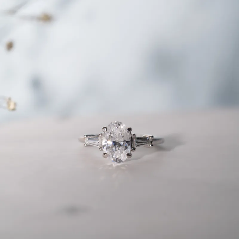 The Aurora | Lab Diamond Oval & Tapered Baguette Cut Engagement Trilogy Ring sold by Ethica Diamonds