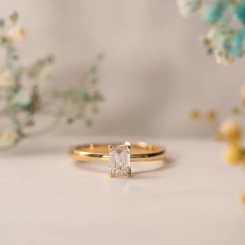 The India | Emerald Cut Lab Diamond Feminine Solitaire Engagement Ring sold by Ethica Diamonds