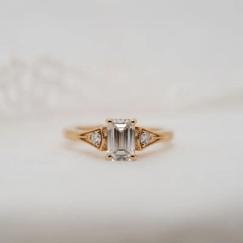 The Ares | Emerald Cut Lab Diamond Accented Milgrain Engagement Ring sold by Ethica Diamonds