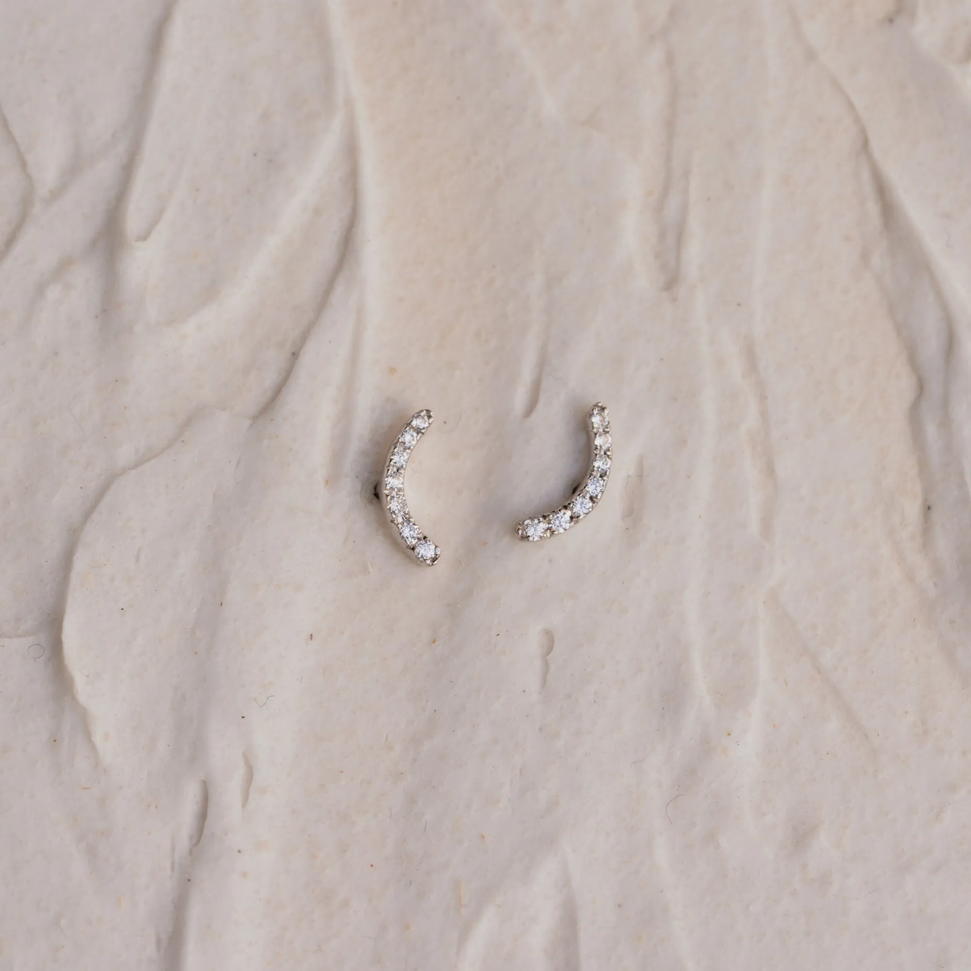 The Mia | Delicate Curve Diamond Stud Earrings sold by Ethica Diamonds