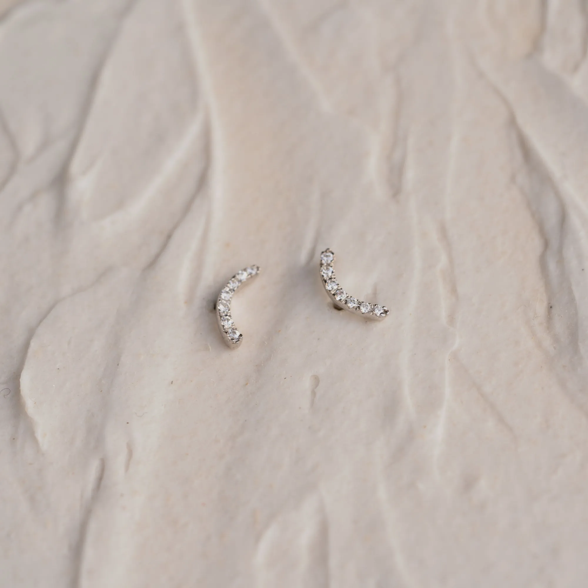 The Mia | Delicate Curve Diamond Stud Earrings sold by Ethica Diamonds product image thumbnail 3