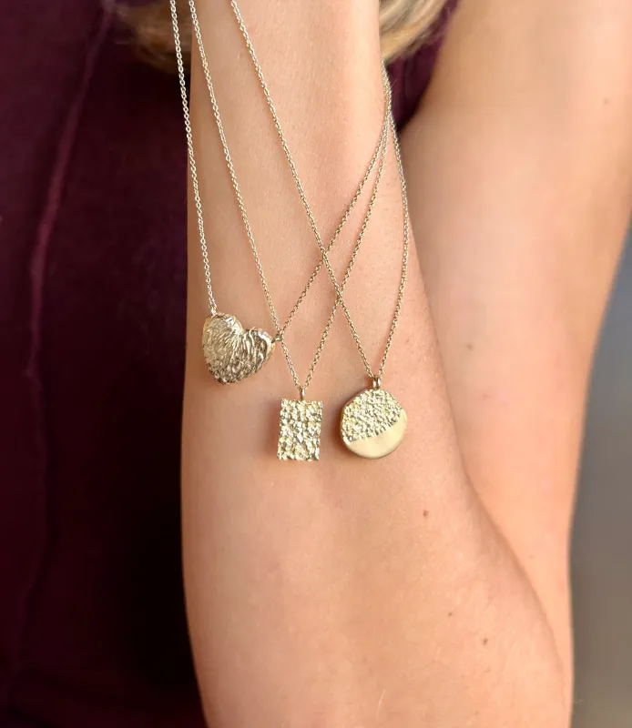 The Phoenix | Textured Gold Disc Pendant sold by Ethica Diamonds