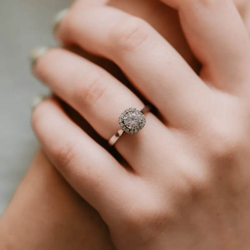 The Ami Ring | Moissanite & Diamond Round Engagement Halo sold by Ethica Diamonds