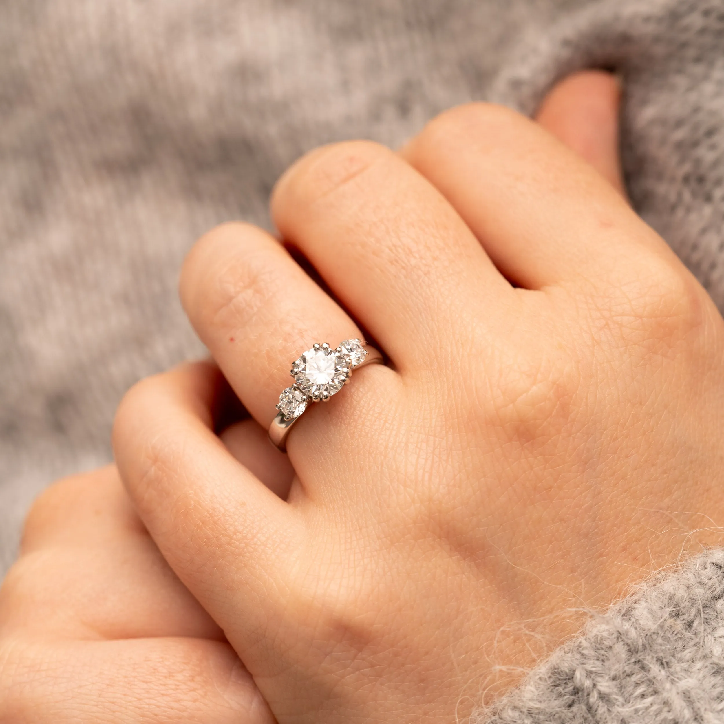 The Amorette Ring | Moissanite Round Split Claw Trilogy Engagement sold by Ethica Diamonds