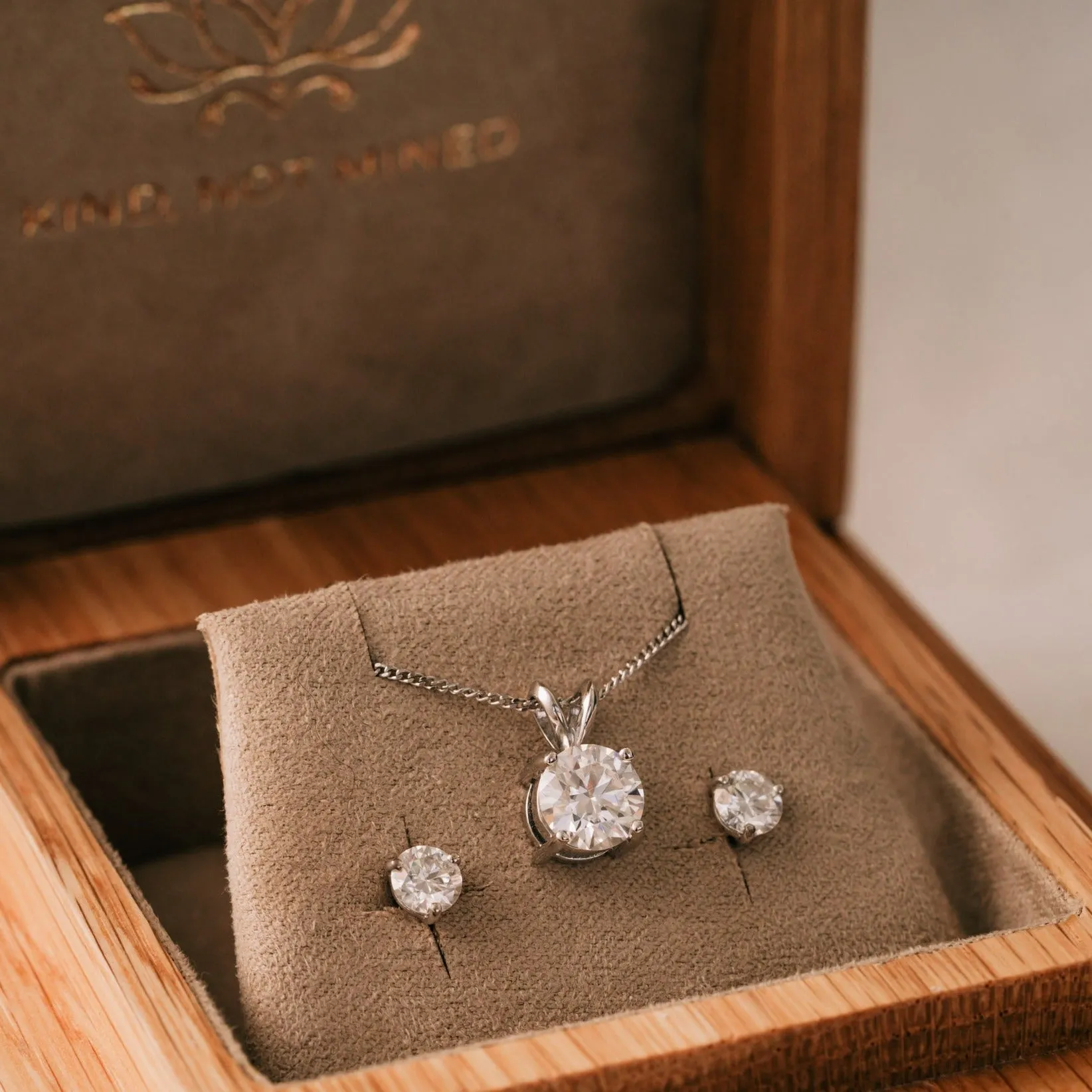 The Martini Earrings | Round Moissanite Three Claw Solitaire Studs sold by Ethica Diamonds product image thumbnail 3