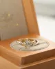 The Nadia Ring | Oval Moissanite & Diamond Marquise Shoulder Set Engagement sold by Ethica Diamonds