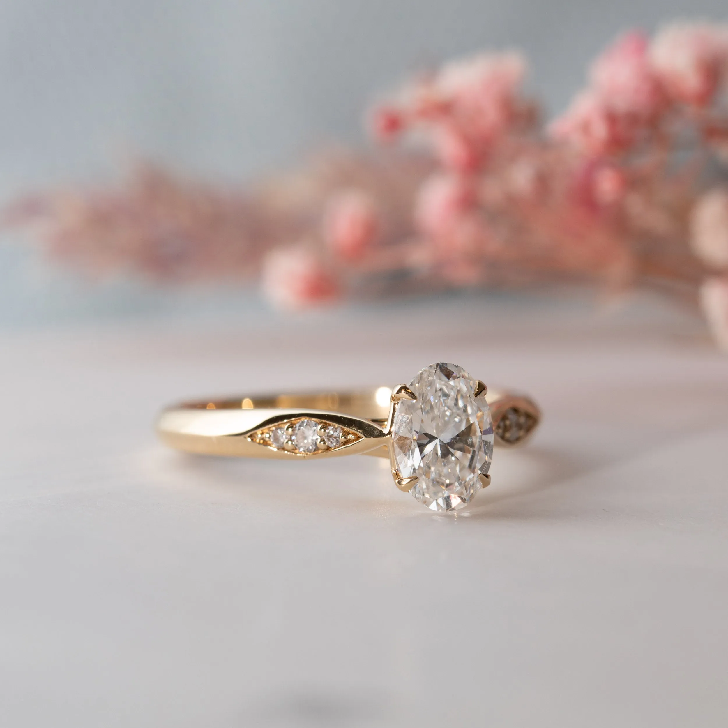 The Celia | Oval Cut Lab Diamond Accented Solitaire Engagement Ring sold by Ethica Diamonds