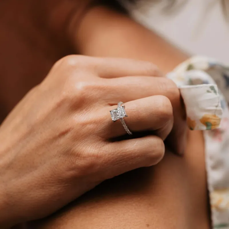 The Sabrine Ring | Moissanite & Diamond Emerald Hidden Halo Engagement sold by Ethica Diamonds