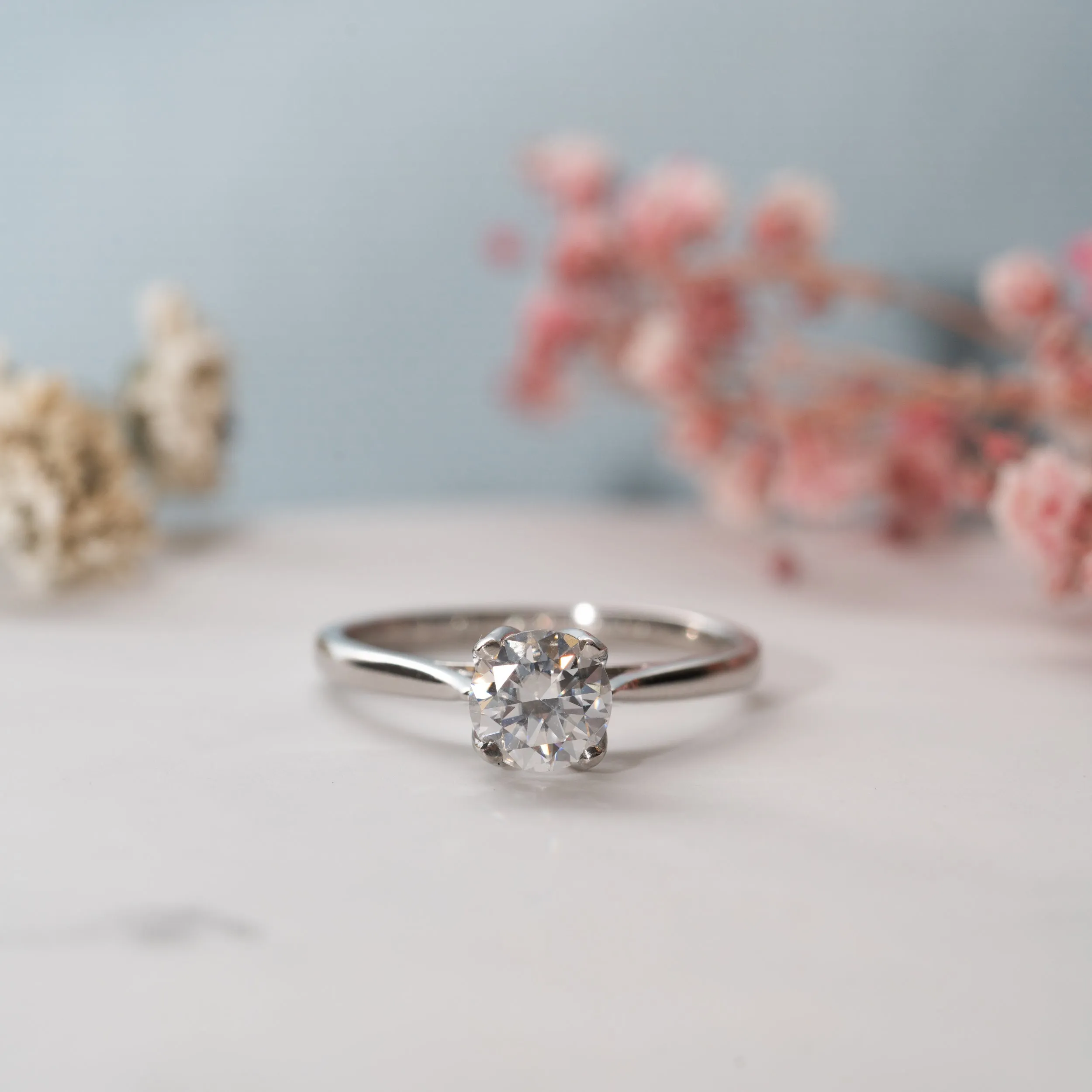 The Lucille Ring | Round Moissanite Floral Petal Engagement Solitaire sold by Ethica Diamonds