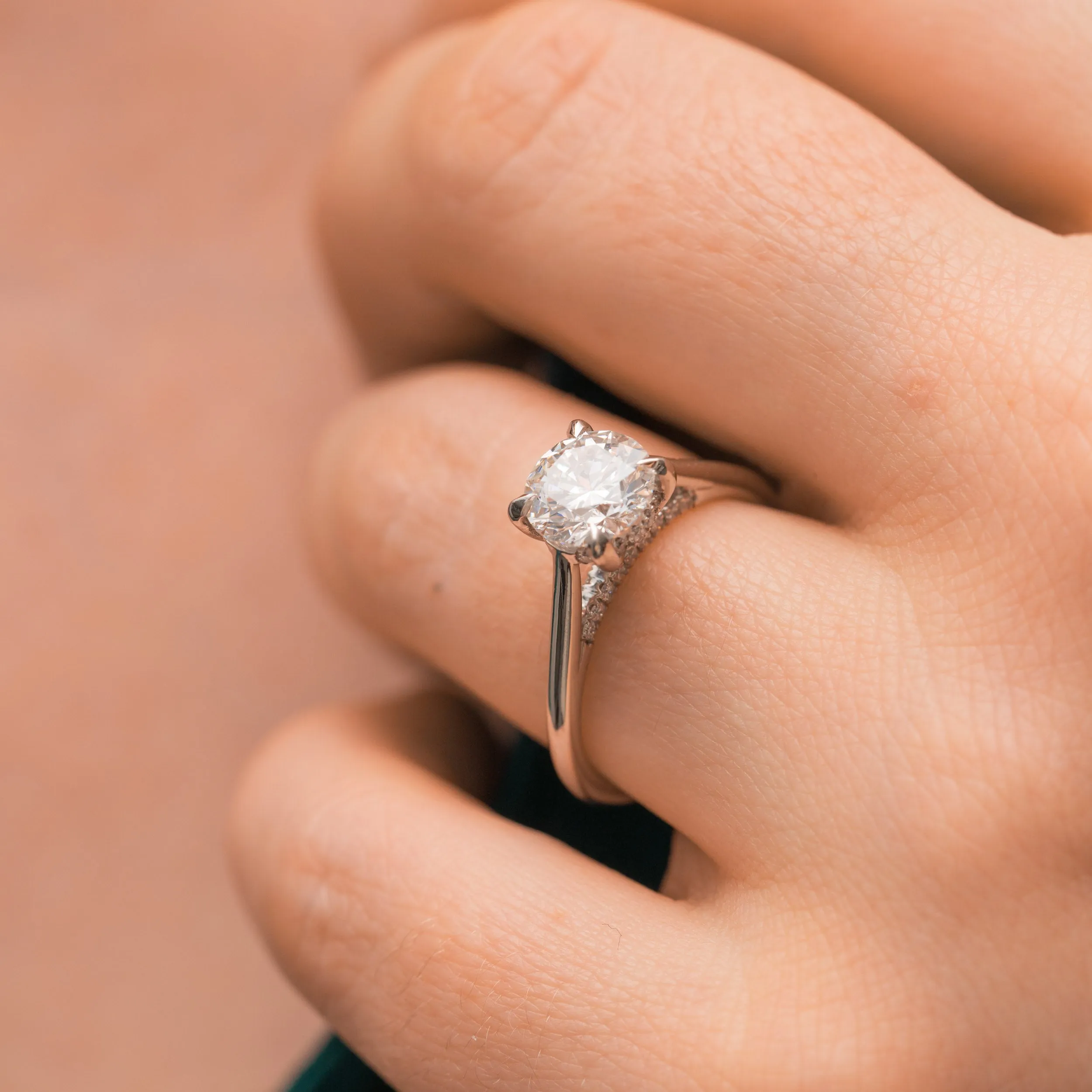 The Flor Ring | Round Moissanite & Diamond Engagement Hidden Halo Solitaire sold by Ethica Diamonds