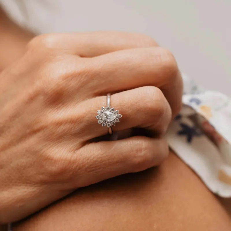 The Dina Ring | Moissanite & Diamond Vintage Pear Engagement Halo sold by Ethica Diamonds