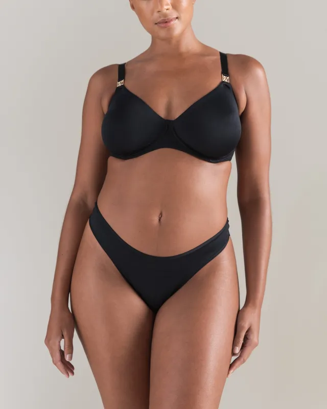The Dipped Thong - Black sold by Nudea