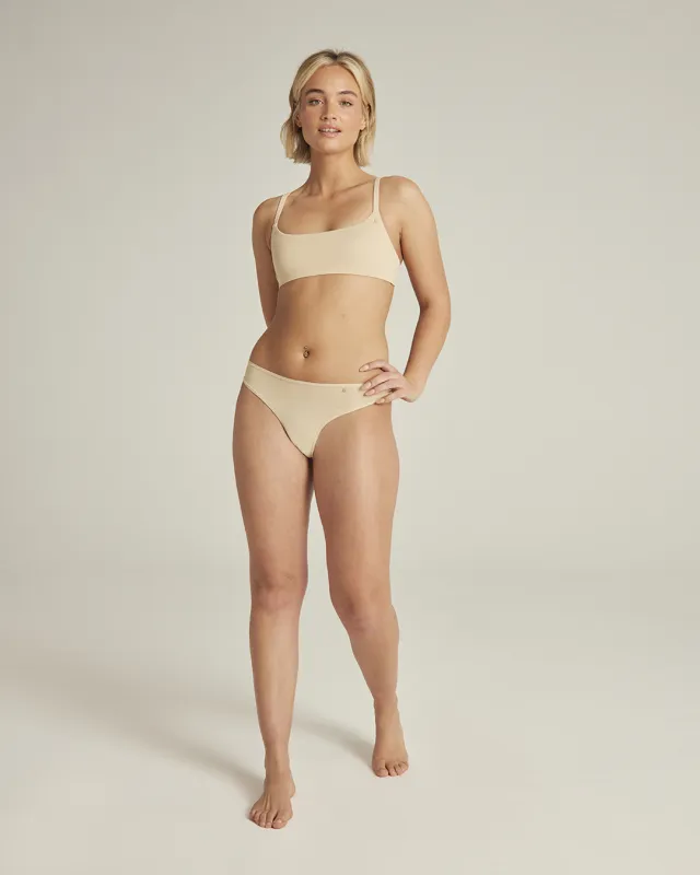 The Stretch Dipped Thong - Bare 01 sold by Nudea