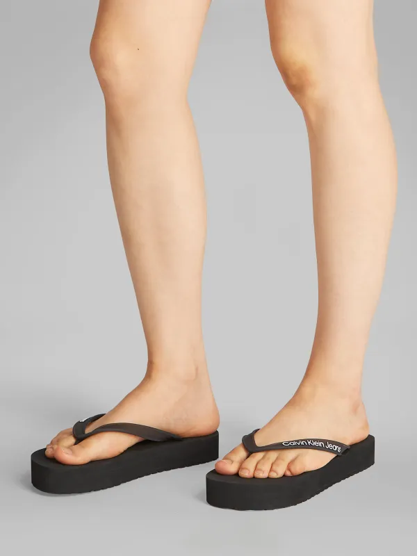 Calvin Klein BEACH SANDAL FLATFORM Womens Sandals Black/Bright White sold by Shuperb