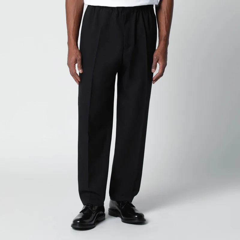Black Technical Serge Trousers sold by Wanan Luxury