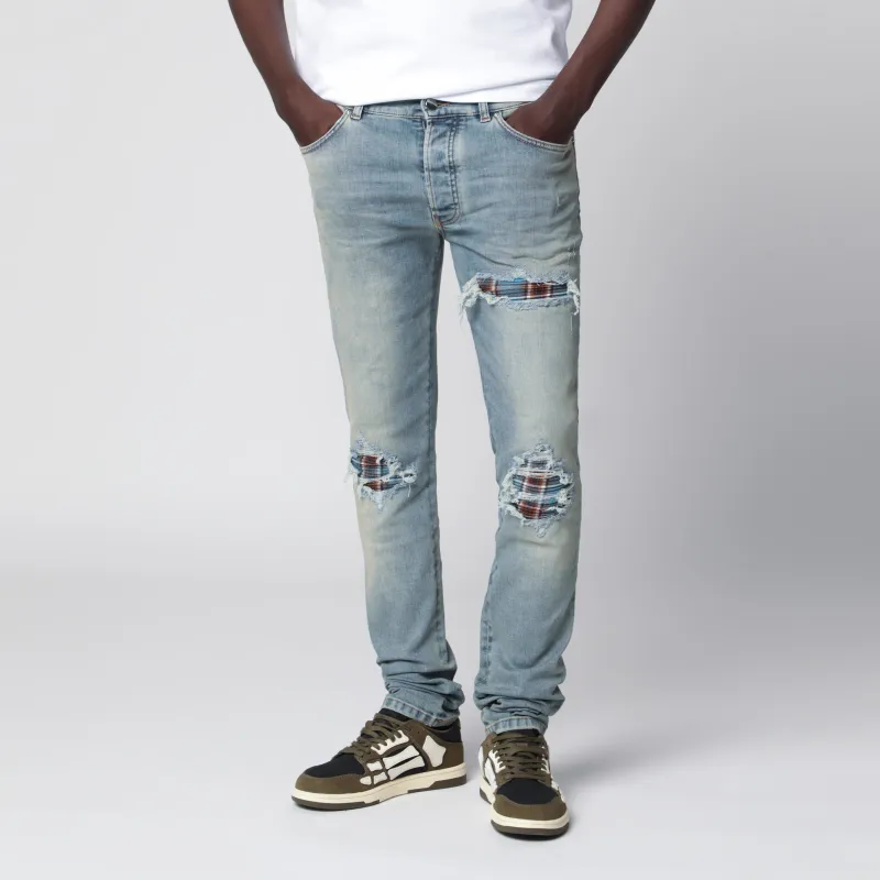 Mx1 Distressed Flannel-Patched Jeans In Medium Indigo made by AMIRI