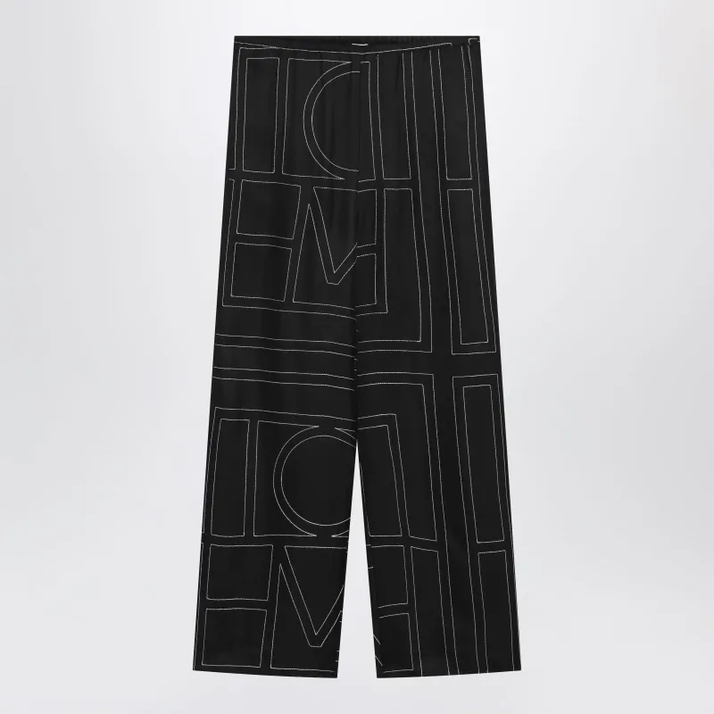 Black Monogram Silk Pajama Trousers made by Toteme