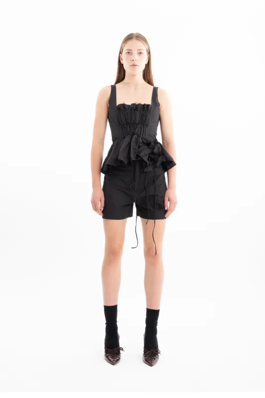 BLACK WRINKLED COTTON SHORTS WITH FLOWER EMBELLISHMENT made by Marques ’ Almeida