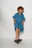 BLUE GINGHAM BOXER SHORTS sold by Marques ’ Almeida