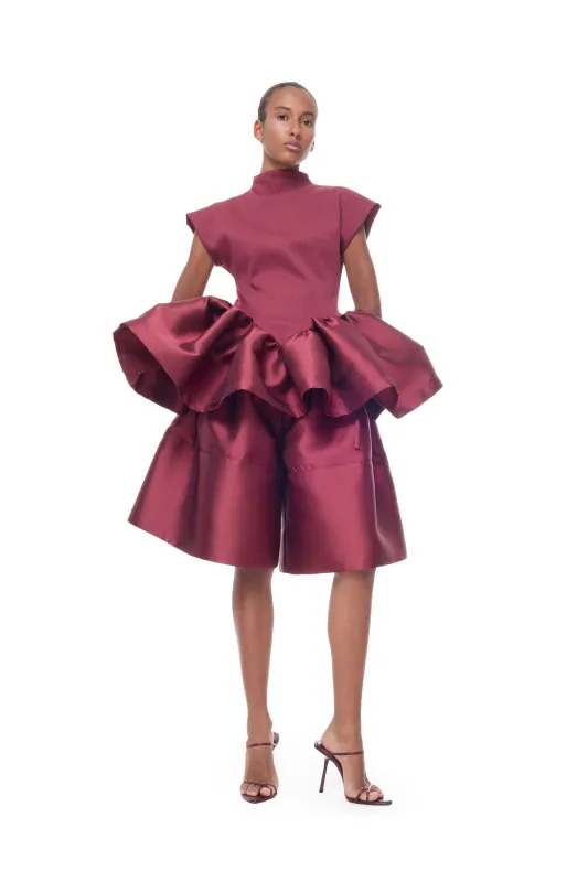 BURGUNDY HEAVY SATIN A-LINE VOLUME SHORTS made by Marques ’ Almeida