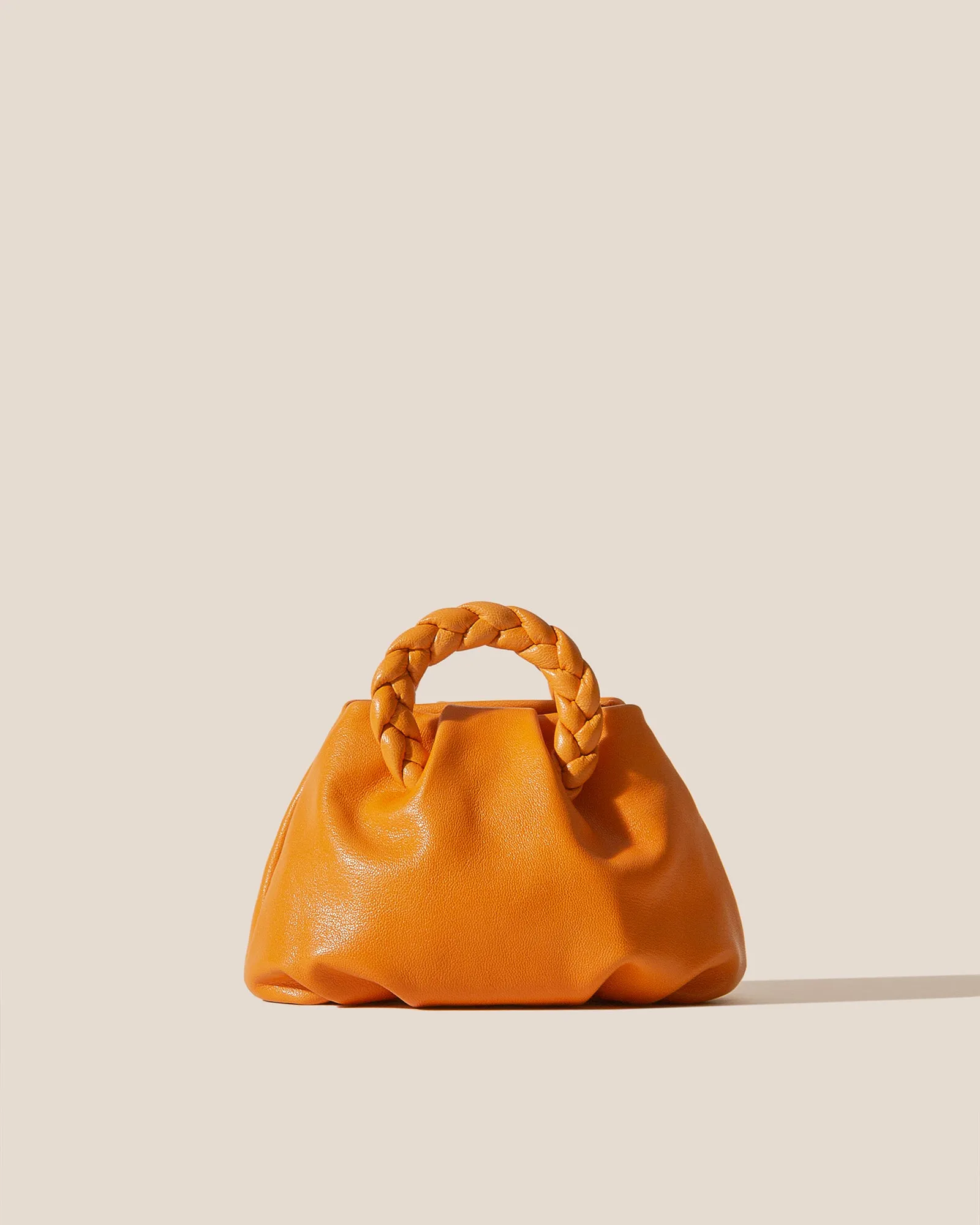 BOMBON SUPPLE SHINY - Plaited-handle Leather Handbag sold by Hereu Studio