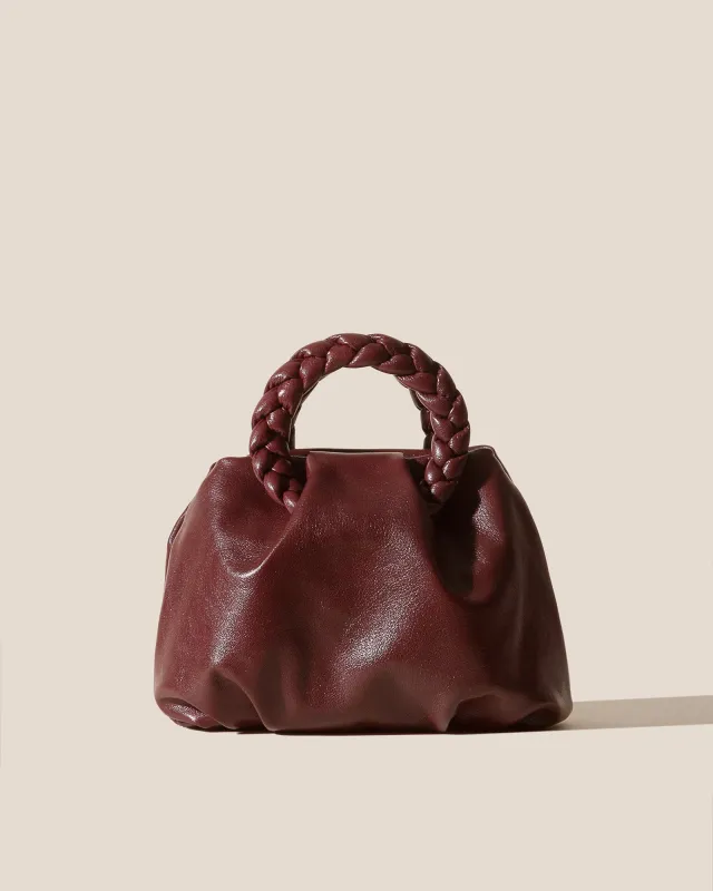 BOMBON M SUPPLE SHINY - Medium Plaited-handle Leather Handbag made by Hereu Studio
