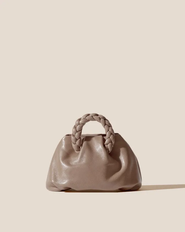 BOMBON SUPPLE SHINY - Plaited-handle Leather Handbag sold by Hereu Studio