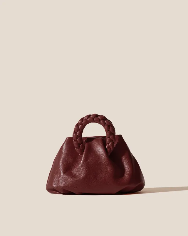 BOMBON SUPPLE SHINY - Plaited-handle Leather Handbag sold by Hereu Studio