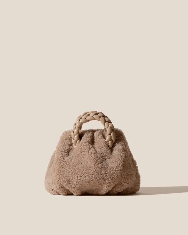 BOMBON CURLY SHEARLING - Plaited-handle Shearling Handbag sold by Hereu Studio
