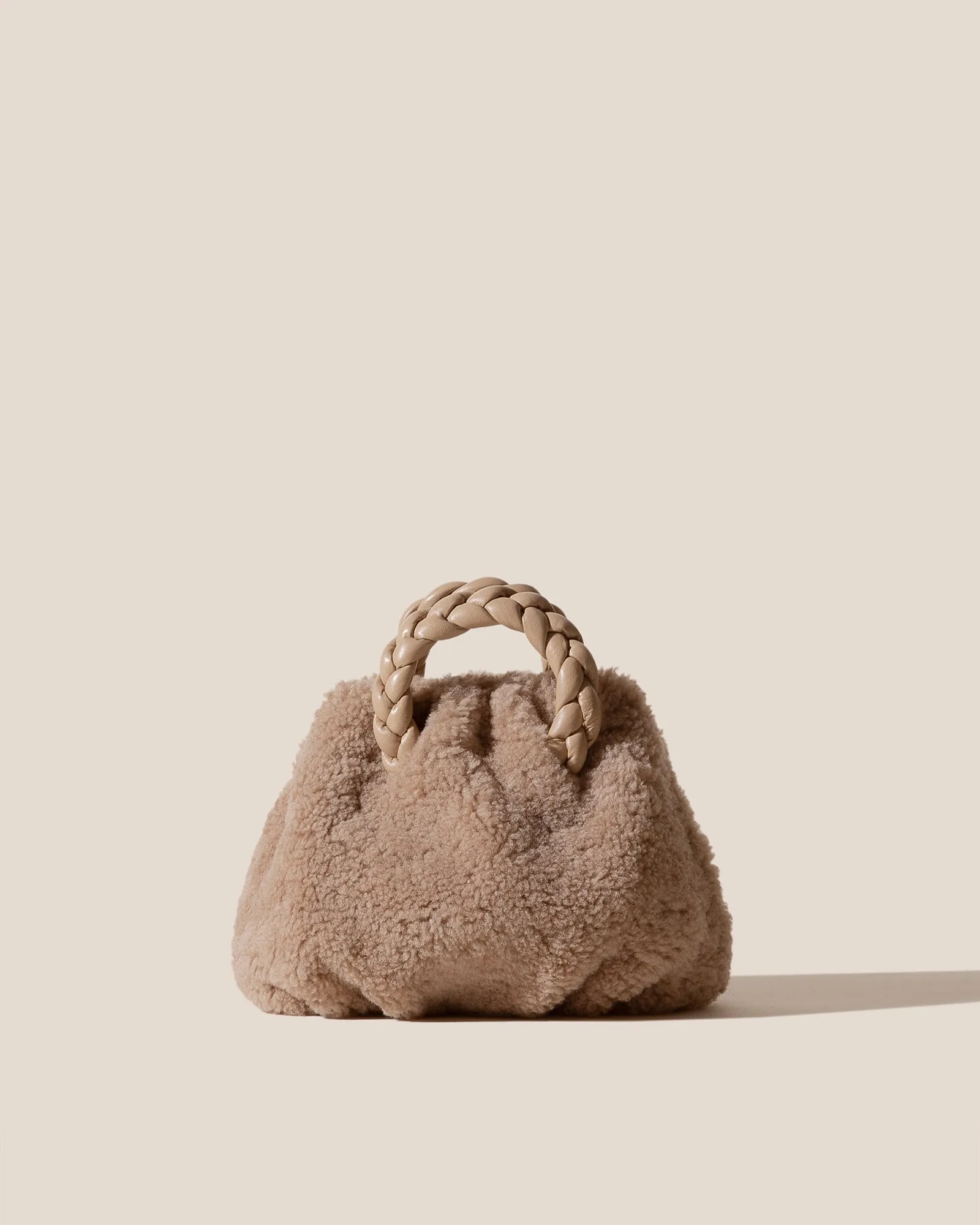 BOMBON CURLY SHEARLING - Plaited-handle Shearling Handbag sold by Hereu Studio