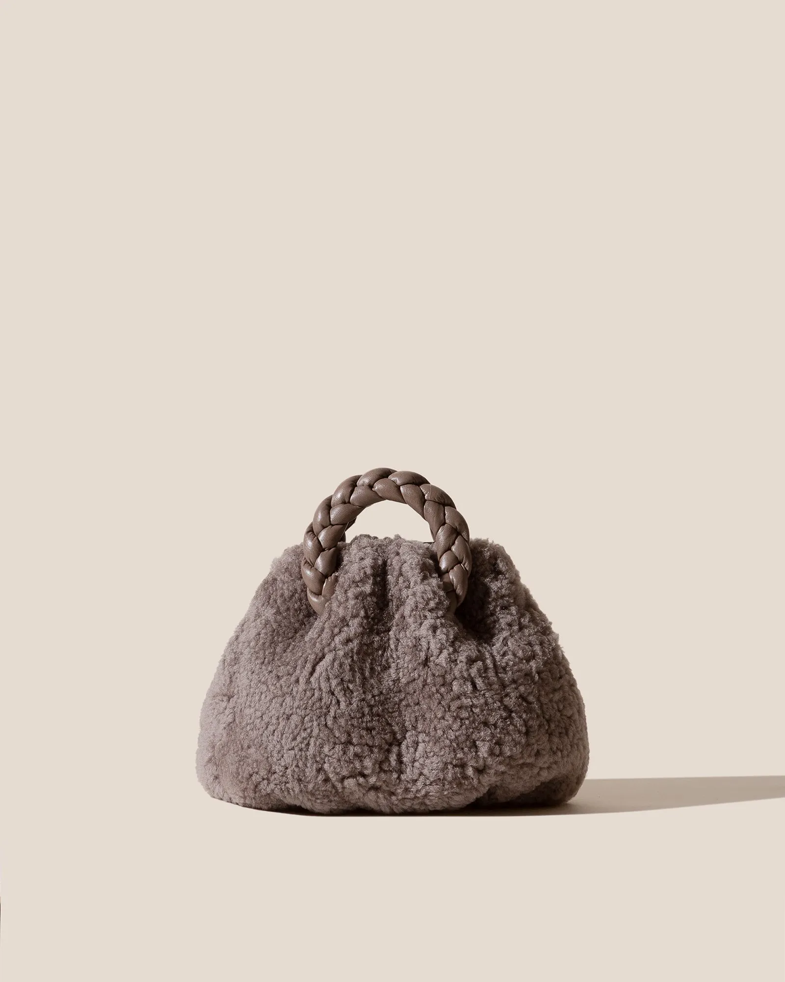 BOMBON CURLY SHEARLING - Plaited-handle Leather Handbag sold by Hereu Studio
