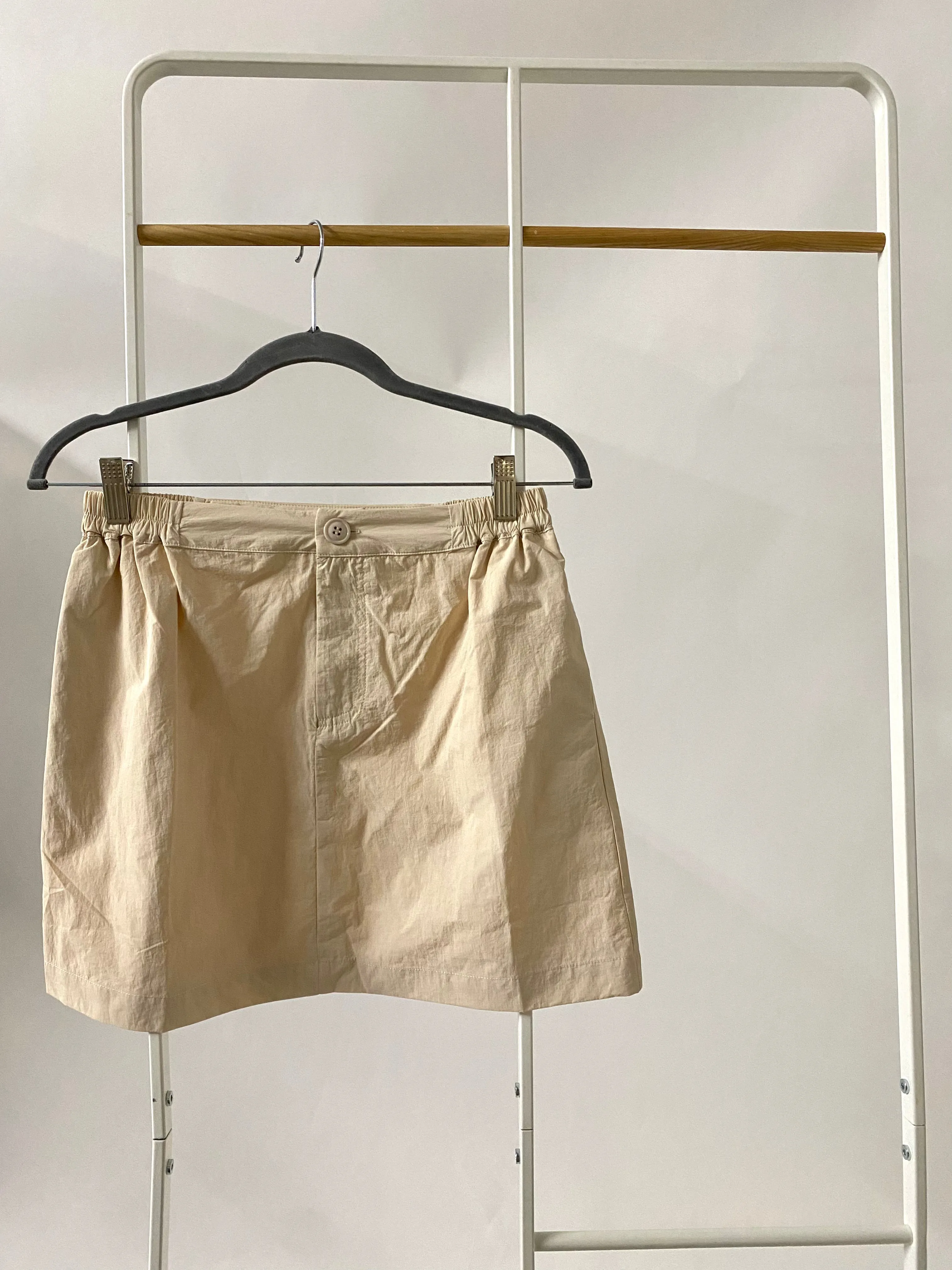 Deidra Nylon Mini Skirt in Cream sold by Worth Collective