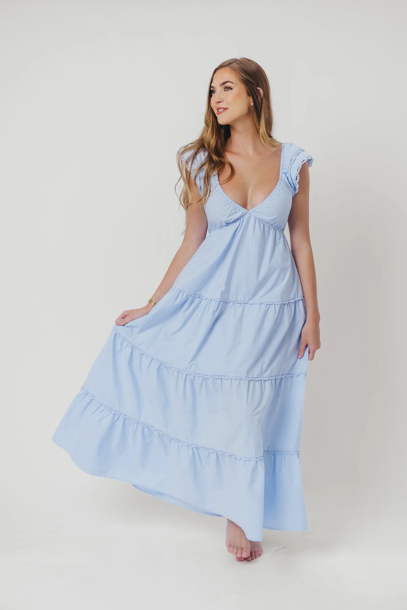 Bliss Tiered Maxi Dress with Ruffled Sleeves in Light Blue sold by Worth Collective