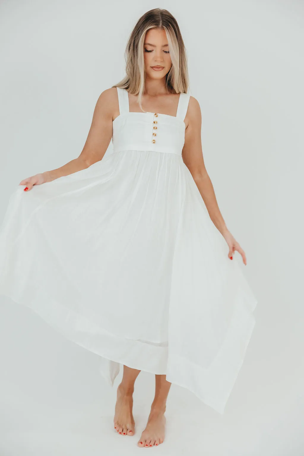 Ariella Sleeveless Midi Dress in Off-White sold by Worth Collective