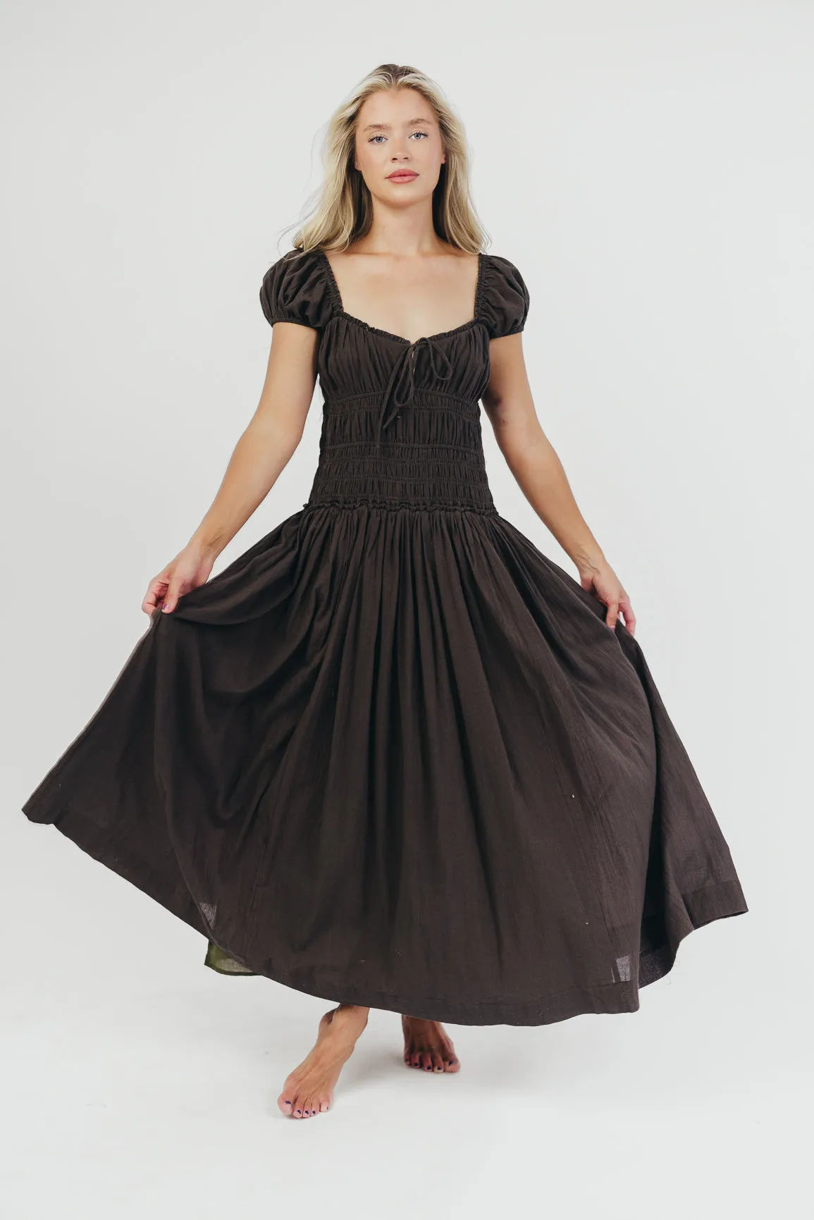 Aria Smocked Maxi Dress with Dropped Waist in Olive sold by Worth Collective