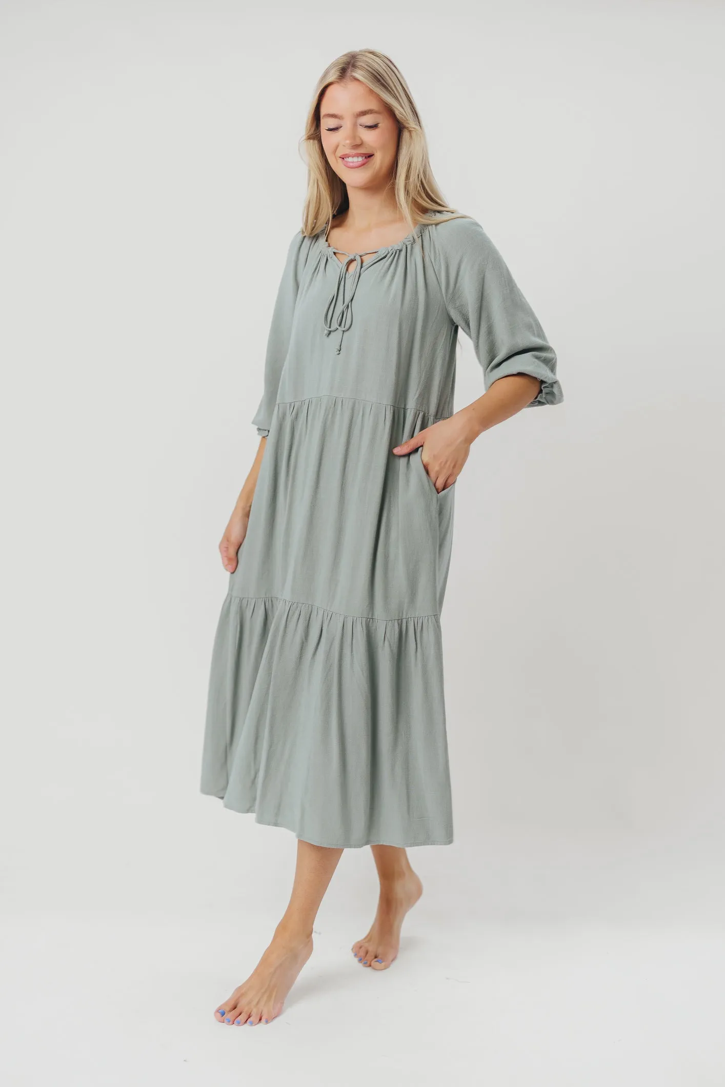 Avery Tiered Linen-Blend Midi Dress in Sage - Bump Friendly and Inclusive Sizing sold by Worth Collective