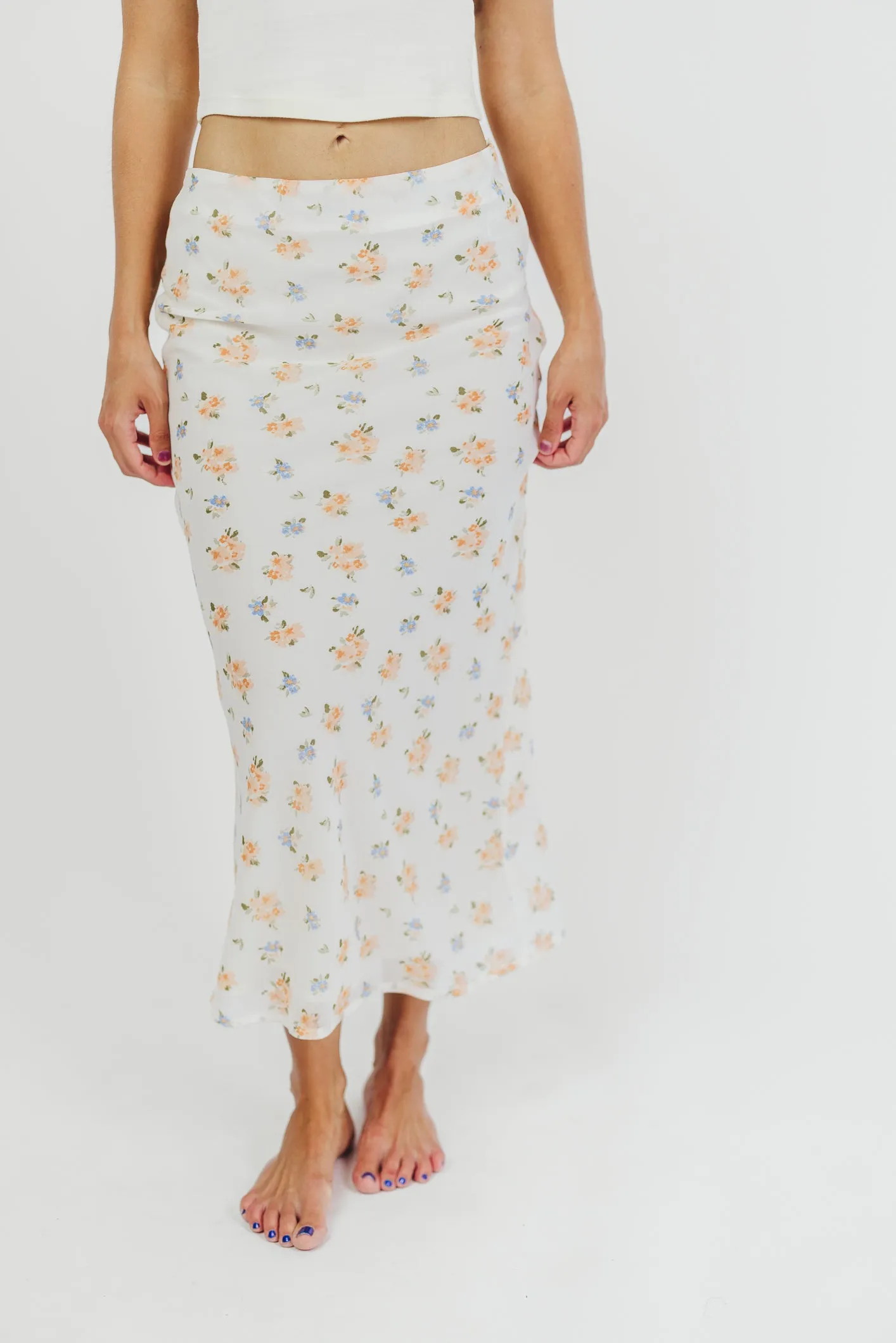 Tessa Bias-Cut Maxi Skirt in Cream Floral sold by Worth Collective