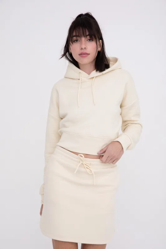 Jace Quilted Cropped Hoodie + Skirt Set in Cream sold by Worth Collective