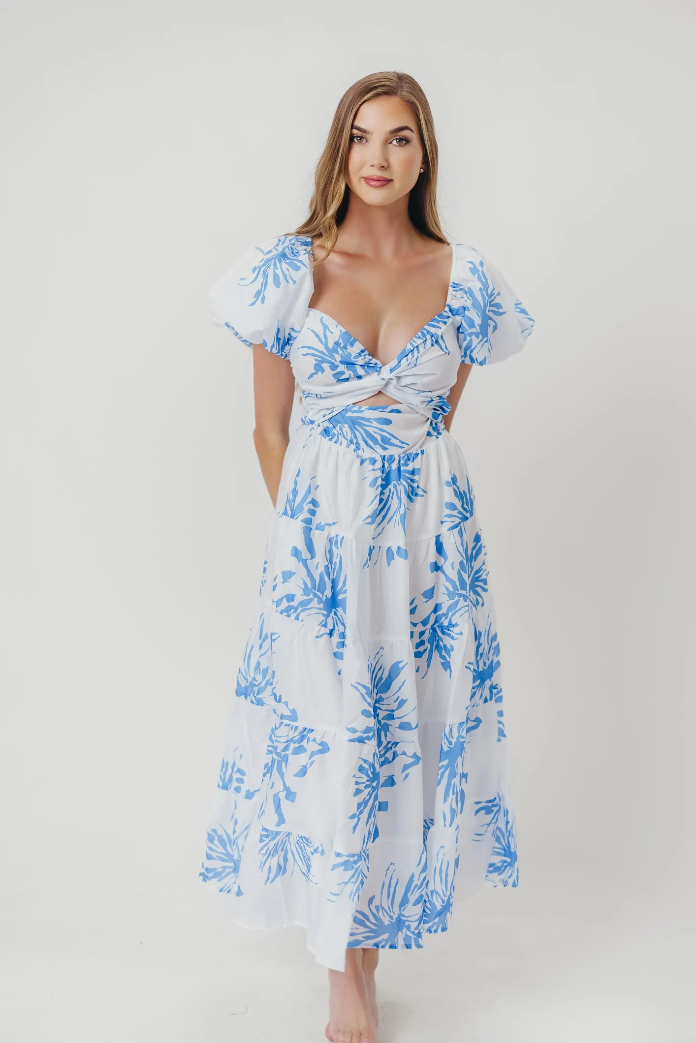 Cora Front Twist Midi Dress in Blue sold by Worth Collective
