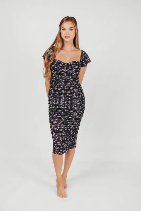 Lilliana Ruched Midi Dress in Navy Floral sold by Worth Collective