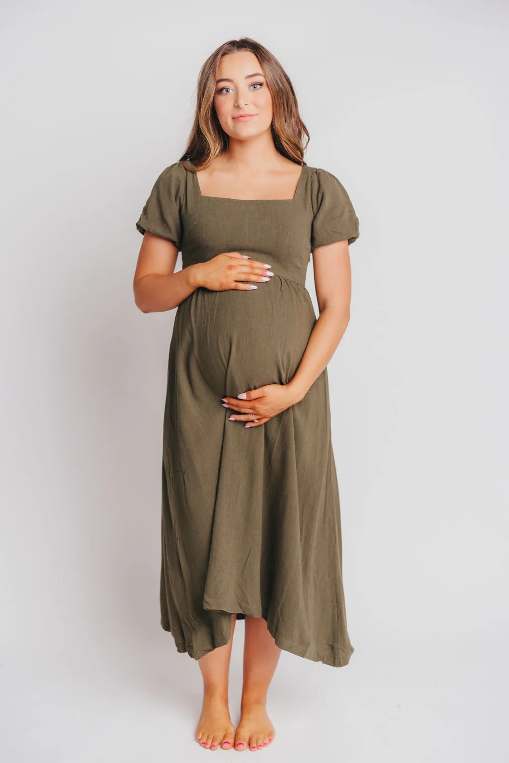 Ainsley Square Neck Midi Dress with Puffed Sleeves in Hunter Green - Bump Friendly sold by Worth Collective