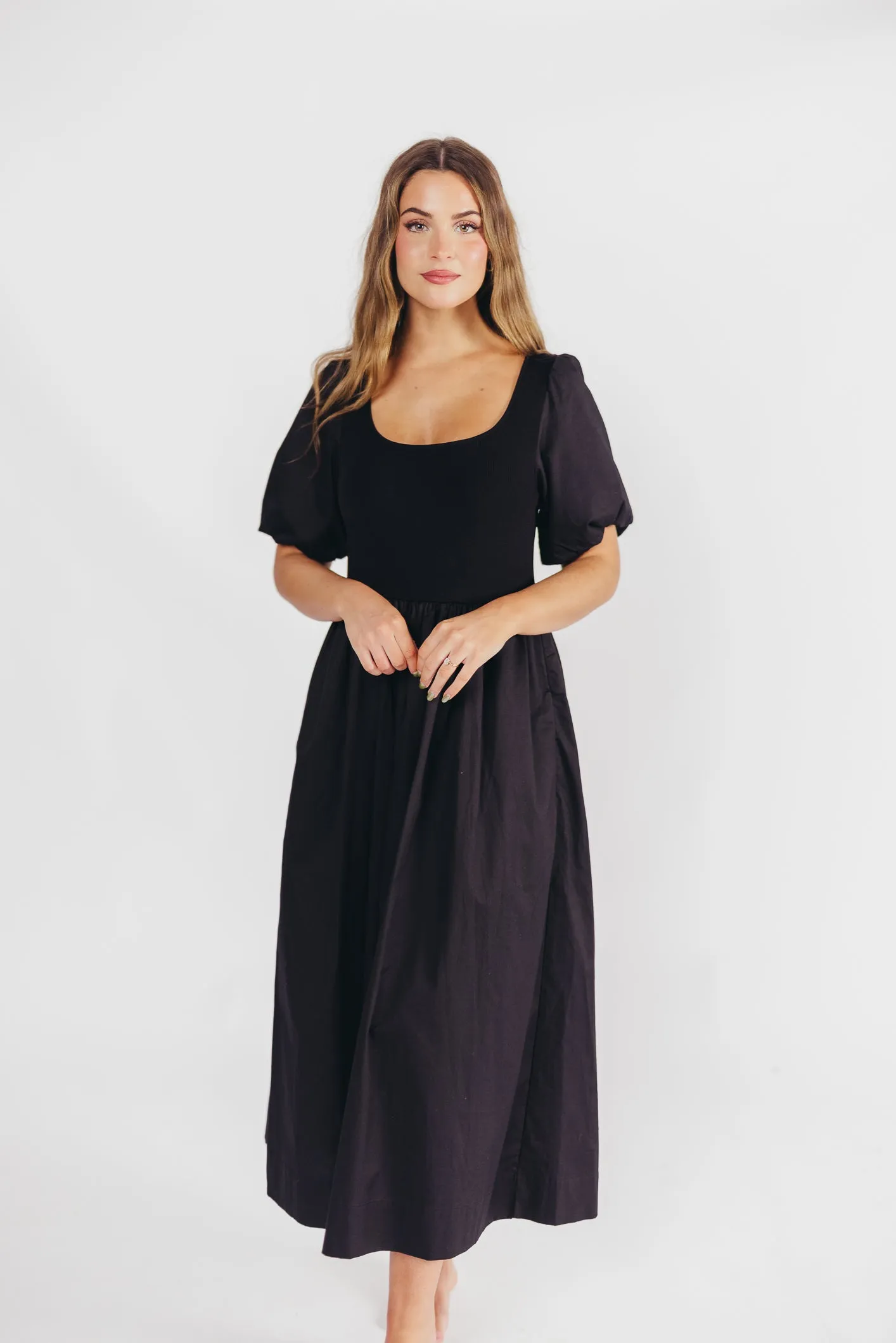 The Premium Alana Midi Dress in Black sold by Worth Collective