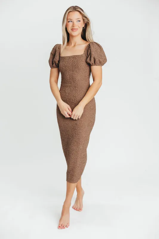 Mila Puffed Sleeve Midi Dress in Brown sold by Worth Collective