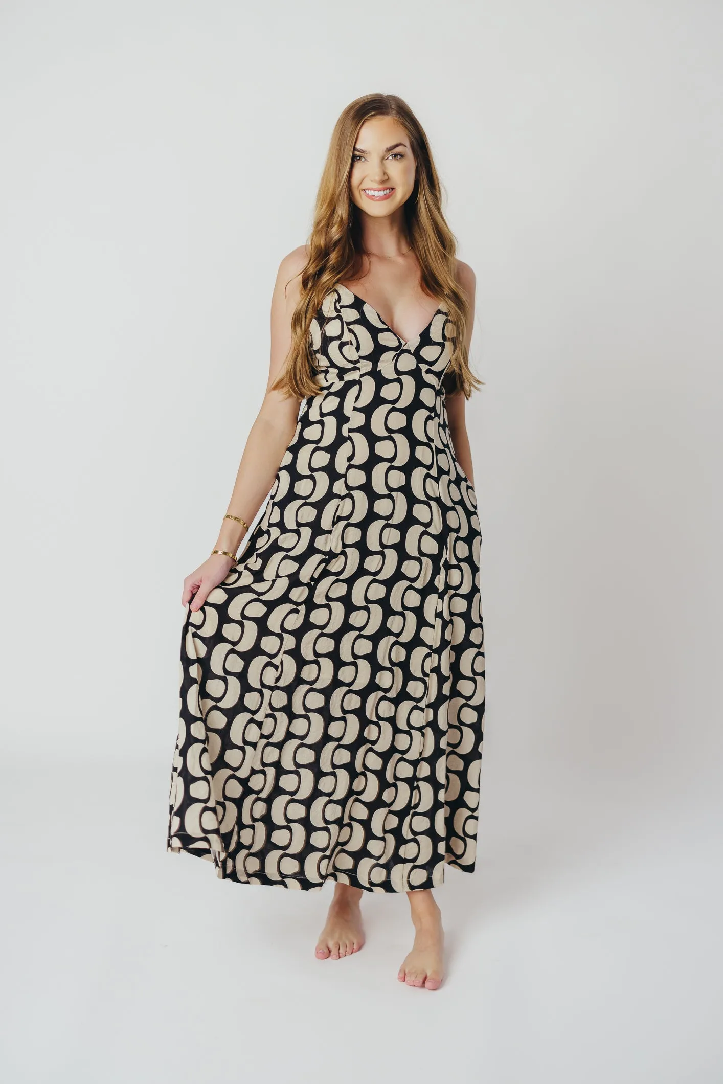 Michelle Open Back Midi Dress in Black sold by Worth Collective