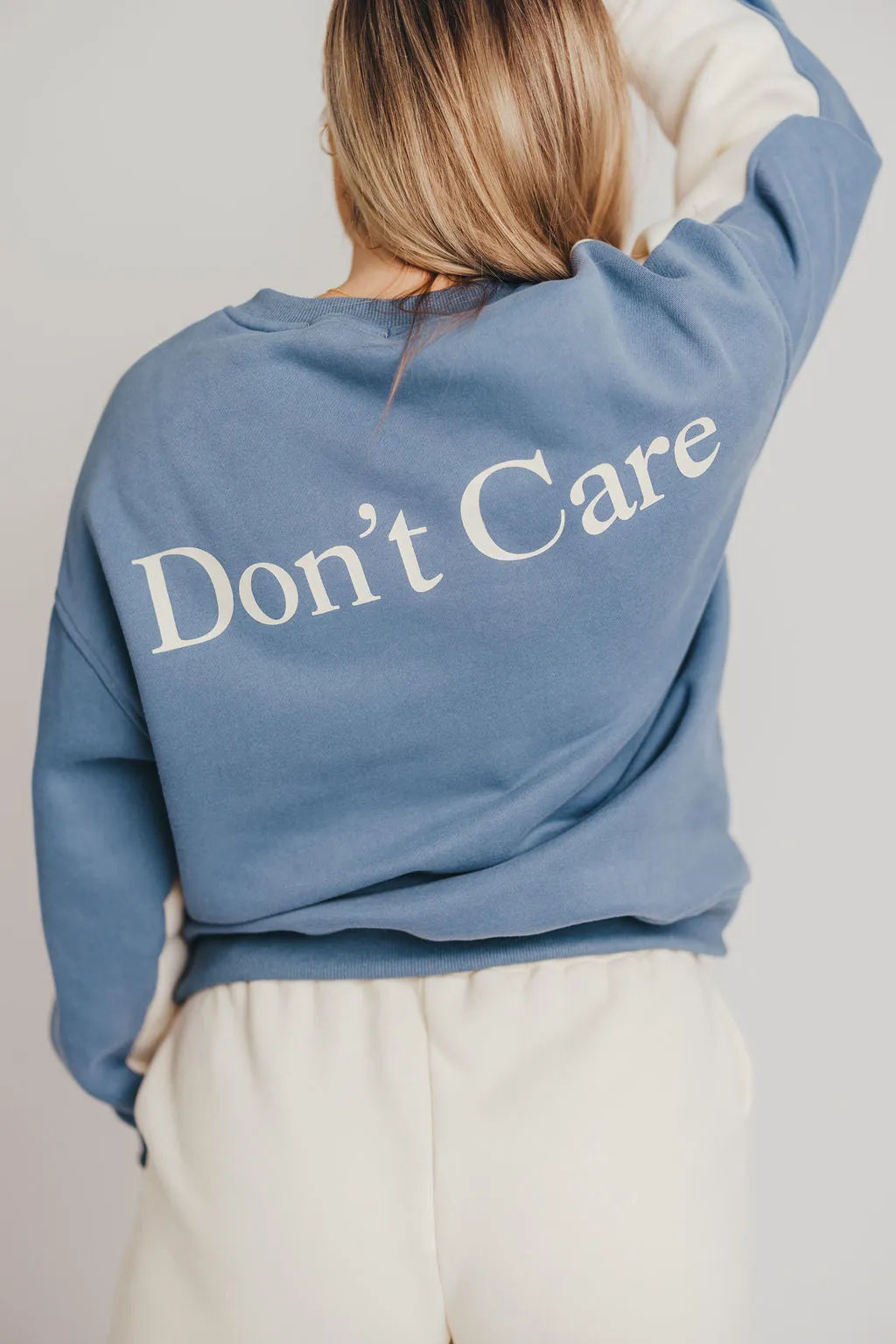 Blythe "Don't Know, Don't Care" Pullover in Cream/Vintage Blue sold by Worth Collective