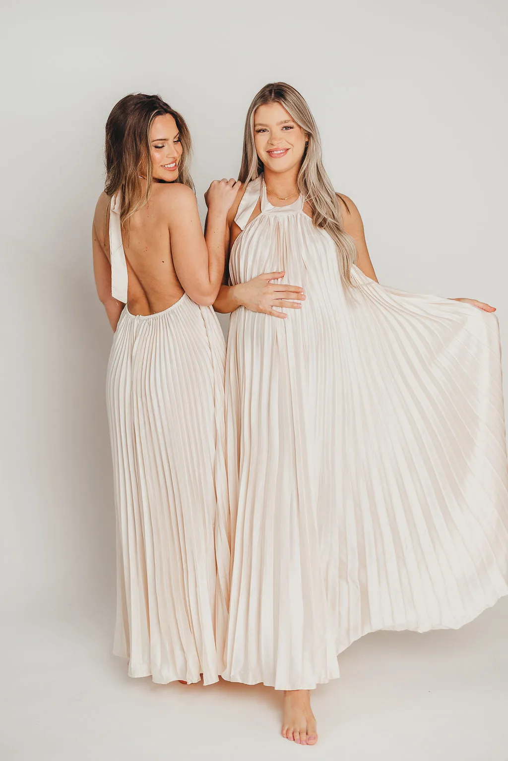 Maren Pleated Halter Maxi Dress in Cream - Bump Friendly sold by Worth Collective