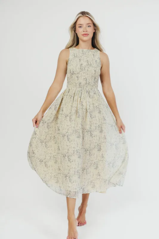Alaina Floral Print Smocked Midi Dress in Blue Multi sold by Worth Collective