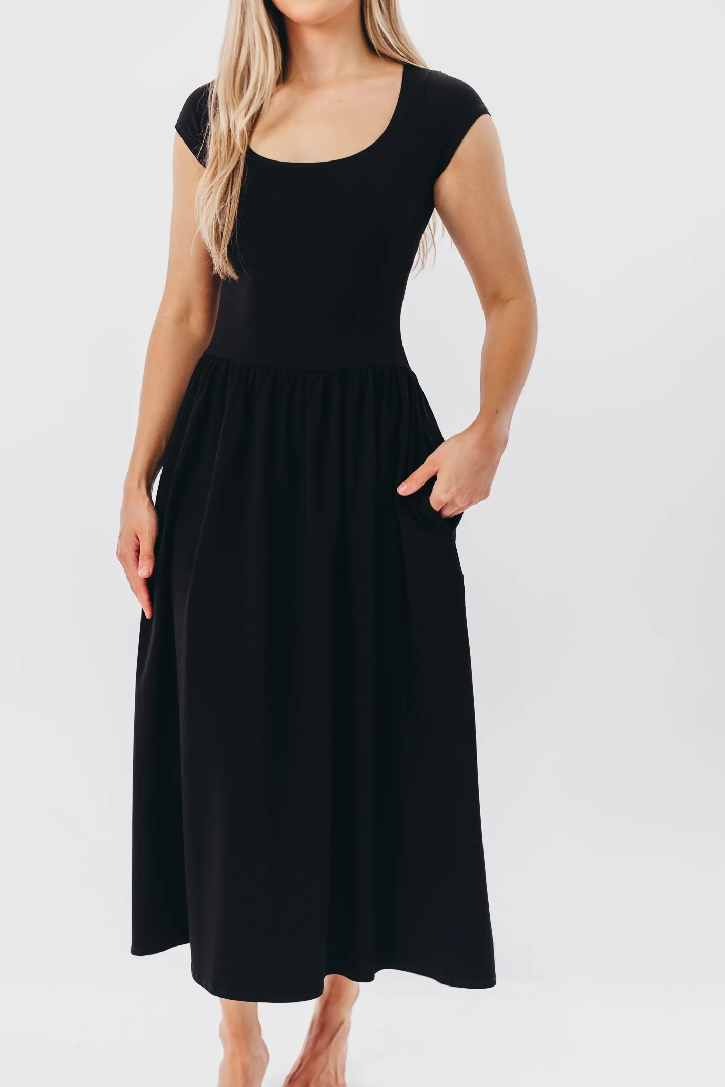 Larissa Cap Sleeve Midi Dress in Black sold by Worth Collective